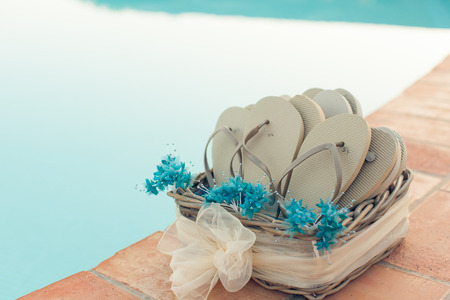 Poolside slippers near the pool at evening close-upの写真素材