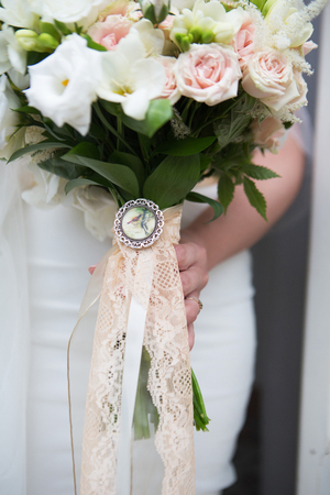 The bride holds a wedding bouquet in the style boho close-upの写真素材