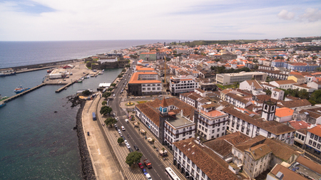 A view on Ponta Delgada marina, Sao Miguel, Azores, Portugal. Moored yachts and boats along the port piers on a beautiful morning. 23 April 2017のeditorial素材