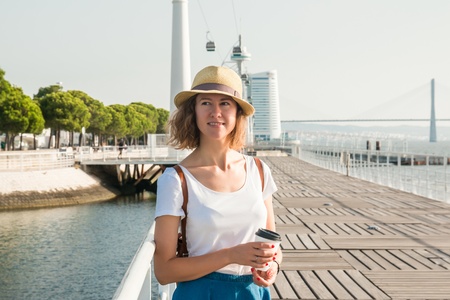 Attractive young woman walking in Lisbon near Tajus river at Park of the Nationsの写真素材