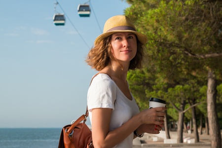 Attractive young woman walking in Lisbon near Tajus river at Park of the Nationsの写真素材