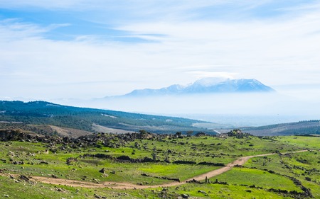 Fields with ruins in the ancient city of Hierapolis, Turkey at sunny dayの写真素材