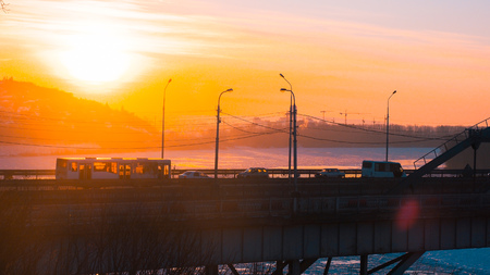 Beautiful panorama of transport on the bridge and sunrise over the Belaya River in Ufa, Bashkiria, Russiaの写真素材