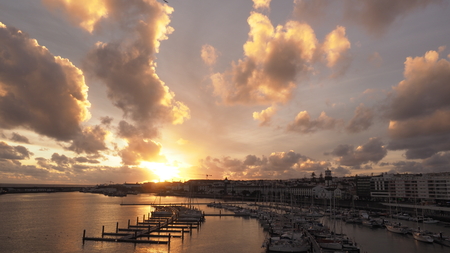 View of harbor at Ponta Delgada, Azores, Sao Miguel Island at sunset. Ocrober 10, 2018. Azores, Portugal.の写真素材