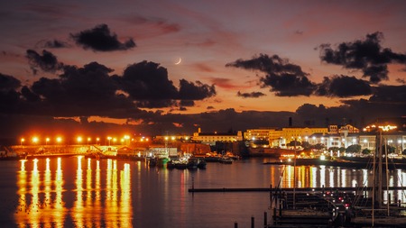 Night view of harbor at Ponta Delgada, Azores at Sao Miguel Island at epic sunset. Ocrober 10, 2018. Azores, Portugal.の写真素材