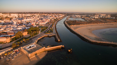 Aerial view of beautiful cliffs and beach near Lagos, Algarve, Portugal at sunriseの写真素材