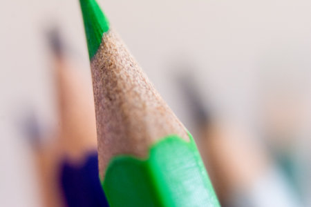 Close up of colored pencils on a white background. Shallow depth of field.の写真素材