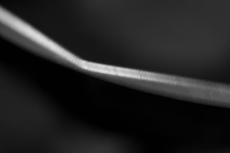 black and white macro close-up of blade of grass, abstract backgroundの写真素材