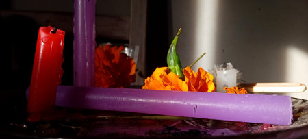 Candles and flowers on a table in the interior of the roomの写真素材