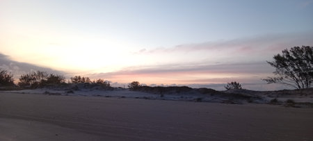 Sunset over the dunes of the Sea in winter.の写真素材