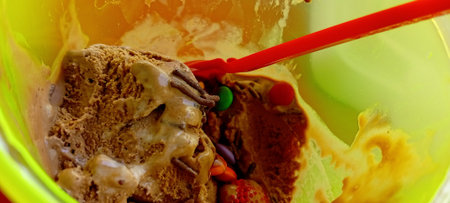 Close up of ice cream in a bowl with a spoon. Selective focus.の写真素材