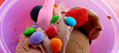 Ice cream with colorful candies on top, close-up.の写真素材
