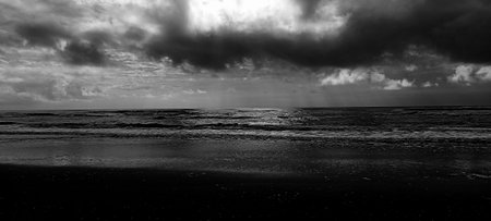 Black and white panoramic view of Baltic sea shore under dramatic sky.の写真素材