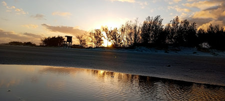 Sunset on the beach in the winter, panoramic viewの写真素材