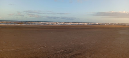 Panoramic view of the beach at sunset in the evening.の写真素材