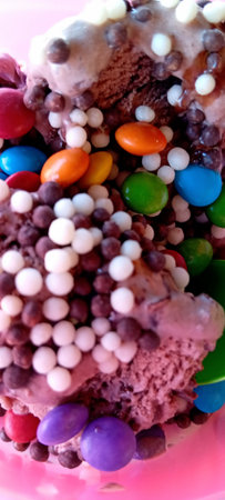 close up of chocolate ice cream with multicolor drageeの写真素材