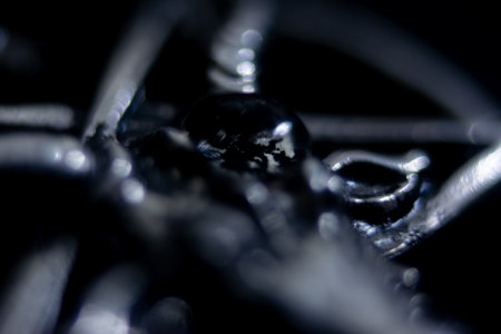 Close-up of a metal structure on a black background. Macro.の写真素材