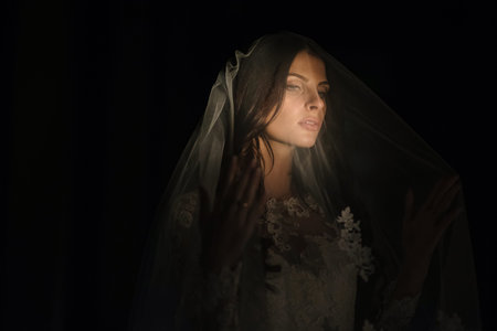 Portrait of bride in wedding dress at luxurious suites, a luxury apartment.