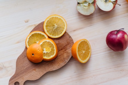 Fresh red and green apple, orange on wooden decks. Fruit, citrus table. Colorの写真素材