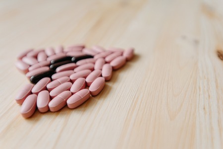 Close up several pills on the desk. Concept of pharmacology and medical supplies.の写真素材