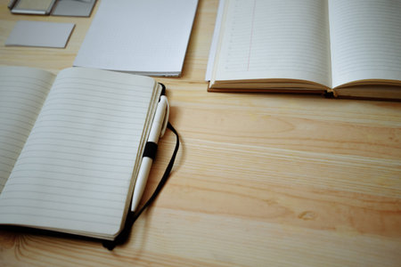 Blank stationery set on old wood background: business cards, booklet, notebook, notepad and pen....
