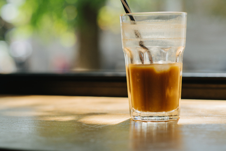 Glass of citrus coffee on the desk front window. Health care.の写真素材