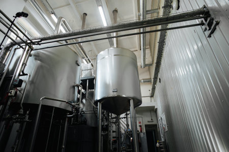 Modern brewery and equipment machinery tools for alcohol production. Steel vats or tanks and...