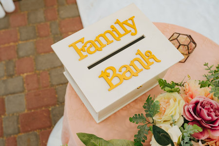 Beautiful wedding set up. Area of the wedding ceremony. Round arch, white chairs decorated with flowers, greenery. Cute, trendy rustic decor. Part of the festive decor, floral arrangement.の写真素材