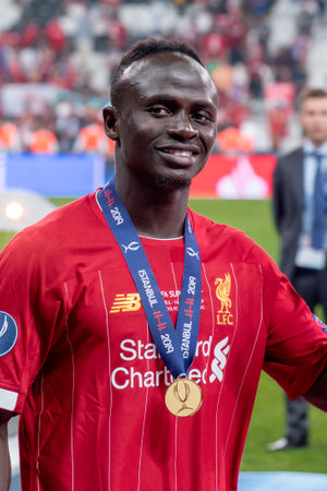 Istanbul, Turkey - August 14, 2019 :: Joy, smiles, cheer of Sadio Mane player of Liverpool FC with happy emotions celebrate UEFA Super Cup trophy victory.のeditorial素材