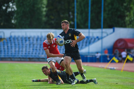 Kharkiv, Ukraine - September 06, 2020: Rugby match of Ukrainian league Olymp - Kredo-63. Beautiful key moment of the game. Powerful athletes playing rugby match. Rugby-15 Ukrainian Championship.のeditorial素材