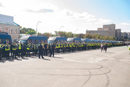 Kharkiv, Ukraine - September 15, 2019: Kharkiv Pride. Group of police officers security guarding peaceful protest. Ukraine Police watch for rights people.のeditorial素材