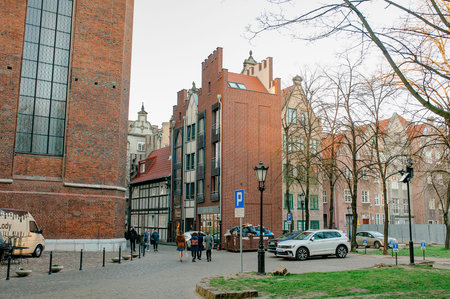 Gdansk, Poland - April 17, 2019: Old street, typical decorative medieval tenement houses in Gdansk