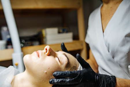 Face skin care. Face massage. Acne. Medical procedure.の写真素材