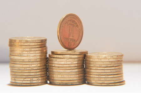 Ukrainian coin stacks on a light background
