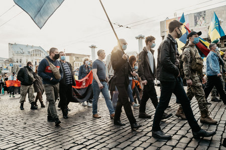 KHARKIV, UKRAINE - OCTOBER 14, 2020: Members of nationalist organizations, Ukrainian veterans of Russian-Ukrainian war, volunteers and relatives of soldiers, who were injured on war on Eastern Ukraine during march in Kharkivのeditorial素材