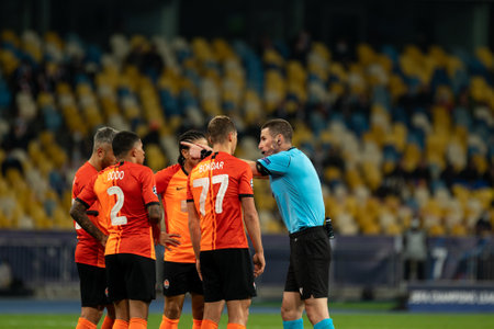 KYIV, UKRAINE - OCTOBER 27, 2020: Referee Georgi Kabakov and football players during the football match of Group B of UEFA Champions League FC Shakhtar vs Internazionaleのeditorial素材