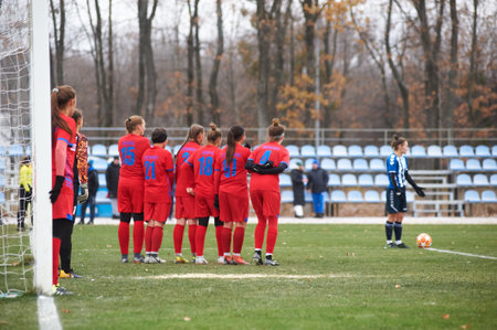 KHARKIV, UKRAINE - NOVEMBER 20, 2020: The football match of Ukrainian Football match of Ukraine league Zhitlobud-1 - Nika at Sport camp of Metallist without fans.のeditorial素材