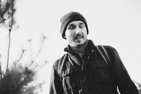 Happy traveler man. Outdoor close up portrait of man. Winter fashion, Christmas holidays concept....
