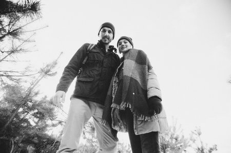 Winter love story, a beautiful stylish young couple. Young romantic couple is having fun outdoors. Enjoying spending time together in New Year Eve. Two lovers in Saint Valentine Dayの写真素材
