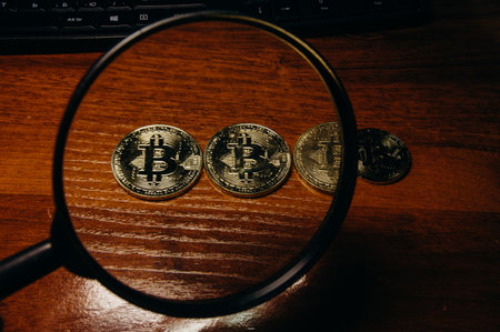 The golden coins with bitcoin symbol background.の写真素材