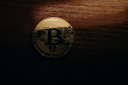 The golden coin with bitcoin symbol background.