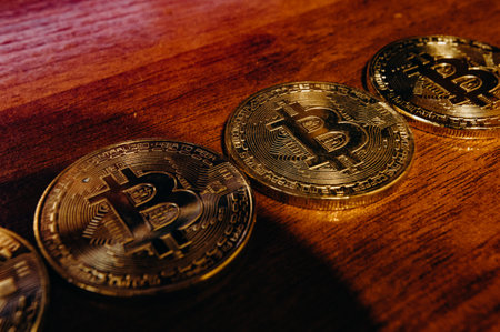 The golden coins with bitcoin symbol background.の写真素材