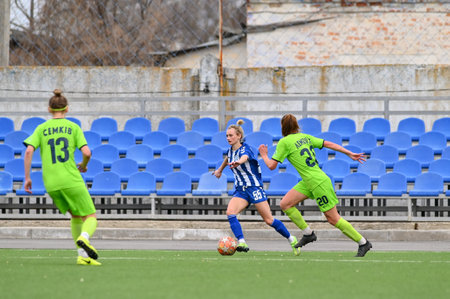 KHARKIV, UKRAINE - APRIL 2, 2021: The football match of Ukrainian Football match of Ukraine league Zhitlobud-1 - Ladomyr at SAvangard Zmiev Stadium without fans.のeditorial素材