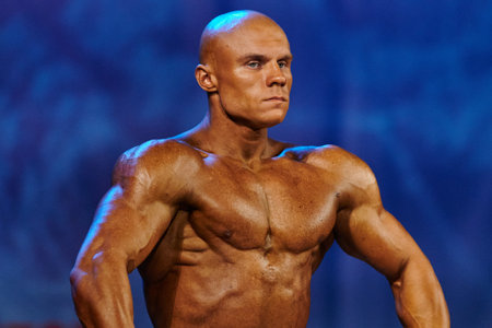 KHARKIV, UKRAINE - APRIL 24, 2021: Bodybuilder participent of Championship of Ukraine in bodybuilding and athletism.のeditorial素材