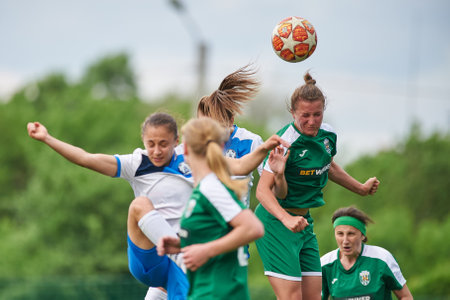 KHARKIV, UKRAINE - MAY 29, 2021: Woman football match Zhilstroi-2 vs. Karpaty. Public events are allowed. Europe match of football during CV pandemic.のeditorial素材