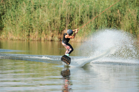 KHARKIV, UKRAINE - July 31, 2021: Championship of Ukraine. Wakeboarder showing of tricks and skills...