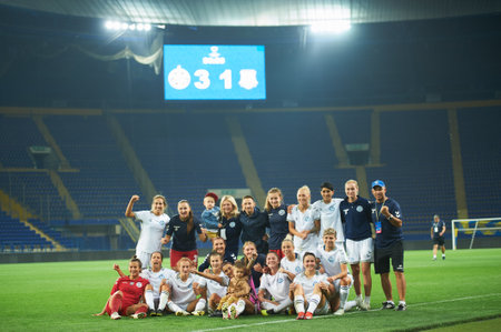 KHARKIV, UKRAINE - SEPTEMBER 9, 2021: Players of Zhilstroi-1 celebrating win in play-off. The football match of UEFA Women's Champions League Zhilstroi-1 vs. Apollon.のeditorial素材