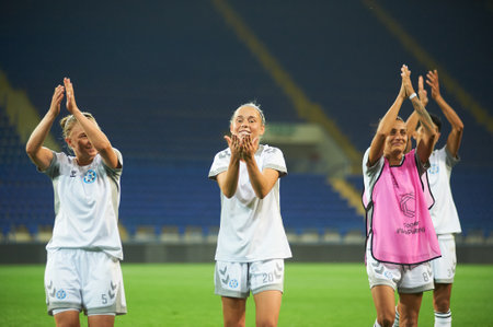 KHARKIV, UKRAINE - SEPTEMBER 9, 2021: Players of Zhilstroi-1 celebrating win in play-off. The football match of UEFA Women's Champions League Zhilstroi-1 vs. Apollon.のeditorial素材