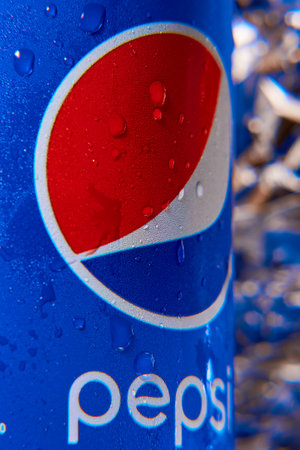 KHARKIV, UKRAINE - DECEMBER 14, 2021: A can of Pepsi drink. Drink of footballのeditorial素材