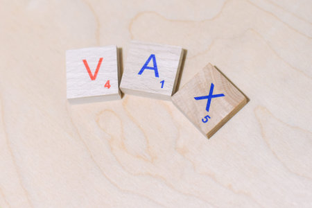 Word vax. The letters are wooden. Alphabet.